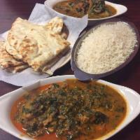 Kukhura Ra Saag · Chicken cooked with spinach.