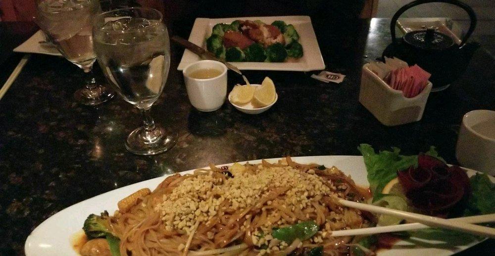 Pad Thai · Thin flat rice noodles with bean sprouts, red and green onions and eggs. Served with lime. Mild spicy.