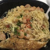 Seafood Pasta · Sauteed Shrimp, Crab, and Scallops in a Buttery Scampi Herb Sauce with Angel Hair Pasta