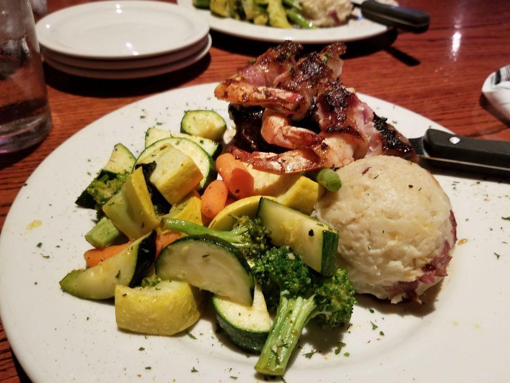 Bourbon St. Special · Blackened or grilled bourbon glazed angus sirloin topped with three bacon-wrapped jumbo gulf shrimp served with garlic mashed potatoes and seasonal vegetables.