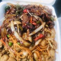 Mongolian Beef · Tender beef strips with sliced bell peppers, onions and carrots stir fried in a spicy Mongol...