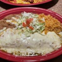 Mariachi Burrito · Flour tortilla layered with refried beans, pork, and chili verde. Topped with tomatillo sauc...