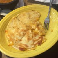 Quesadillas · Grilled flour tortilla stuffed with melted cheddar and white jack cheese and your choice of ...