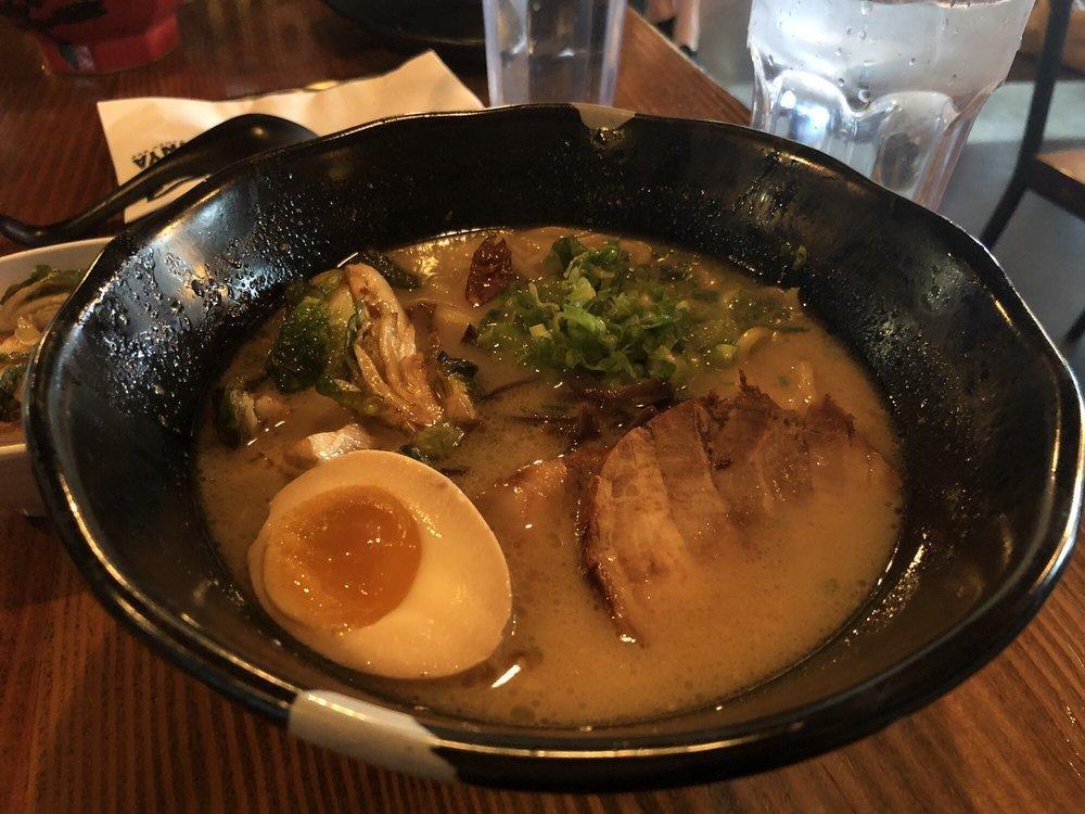Sprouting Up Ramen · Pork and chicken broth, pork chashu, kikurage, spicy bean sprouts, green onion, half seasoned egg, crispy Brussels sprouts, black pepper and ginger. Served with thick noodles.