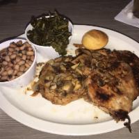 Smothered Pork Chops · 2 pork chops smothered with our house made brown gravy, caramelized onions and white button ...
