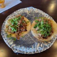 3 Carnitas Tacos · Your choice of 3 tacos includes a side of rice and beans and a drink.