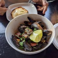 Cajun Mussels · Penn Cove mussels, andouille sausage, Cajun-butter, white wine, cilantro, lime, toasted rust...