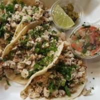 Chicken Kelaguen Tacos · Cold Guam style chicken-coconut salad, green onion, cilantro, thai chile, corn tortillas, pi...