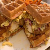 The Belly Buster Sandwich · Marinated fried chicken breast on a buttermilk waffle with pickles, coleslaw and Chipotle sa...