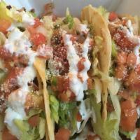 3 Little Pigs Tacos · 3 tacos with a blend of Amish bacon, house smoked pork, Mexican chorizo, wrapped in queso fu...