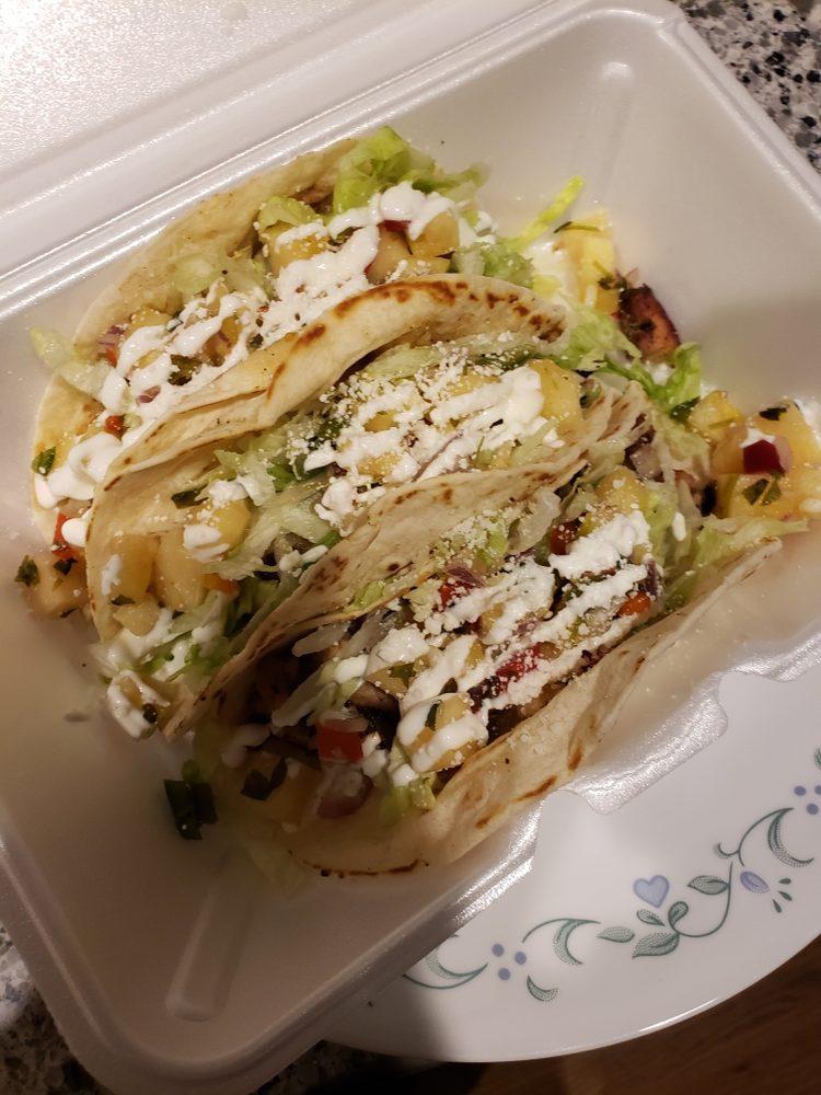 Jerk Chicken Taco · 3 House smoked jerk chicken tacos, shredded lettuce, pineapple salsa, crema and Cotĳa cheese.