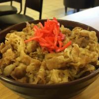 Beef Sukiyaki Rice Bowl · thinly sliced beef cooked with onions in sweet soy sauce juice. served with ginger over rice.