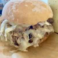 The Vaca Frita Burger · Butter bread, vaca frita (grilled shredded beef), Swiss cheese and mojo sauce.