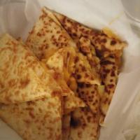 Chicken Quesadilla · Flour tortilla stuffed with chicken, sauteed onions and a blend of cheddar and Jack cheese. ...