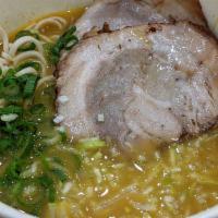 Curry Ramen · A blend of authentic Japanese Curry Spices into Ramen, topped with 2 slices of Chashu, green...