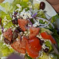 Greek Salad · Fresh romaine, red onions, Kalamata olives, tomato, feta cheese with our Greek dressing and ...