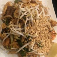 Pad Thai · Stir-fried rice stick noodles with tofu, egg, bean sprout and peanut with choice of meats or...
