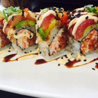 Okini Roll · Crab meat, spicy tuna topped with avocado, tuna, hamachi and tobiko.