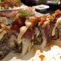 Maguro Fever Roll · Crab meat and deep fried eel topped with seared tuna avocado and spicy tuna.