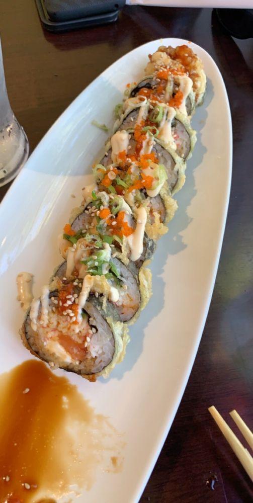 Happy Roll · Spicy salmon, cream cheese, avocado and crab meat, deep fried and topped with tobiko. slightly spicy. 