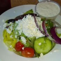 Greek Salad · Lettuce, onions, beets, cucumber, tomatoes, olives, banana peppers, and feta cheese. Served ...