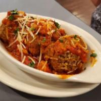 Meatballs · Homemade meatballs over zesty marinara finished with fresh Parmesan.