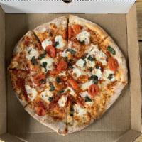 Margherita Pizza · Red sauce, mozzarella, fresh mozzarella, grape tomatoes ＆ fresh basil