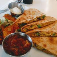 Breakfast Quesadilla · eggs, pico de gallo, chorizo, scallions and cheddar jack stuffed inside a whole wheat tortil...