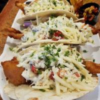 Fish Tacos · flour tortillas stuffed with beer battered atlantic cod, topped with fresh pico, jack cheese...