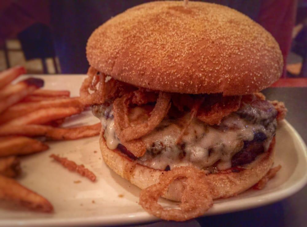 Diablo Burger · choice cajun spiced ground chuck, grilled and topped with bacon, pepper jack cheese, jalapeños, rooster aioli, and crispy fried onions, with seasoned fries 