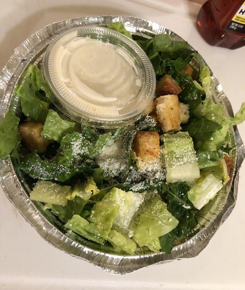 Caesar Salad · An Italian classic made with romaine lettuce, our creamy Caesar dressing and topped with shaved Romano and parmigiano cheeses.