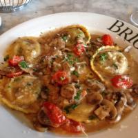 Ravioli Di Bello · Portobello ravioli, crimini mushrooms, roasted grape tomatoes, Grana Padano Zanetti, fresh t...