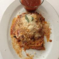 Lasagna Napoletana · Homemade lasagna with ricotta cheese, tomato sauce, fresh mozzarella, small meatballs.