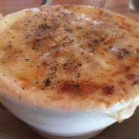 French Onion Soup · The classic served with croutons topped with melted Swiss cheese.