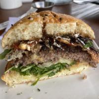 Nutty Goat Burger · Homemade brioche, balsamic onion, garlic, and herb goat cheese and pecan mix, chipotle aioli...