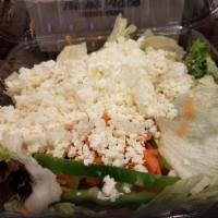 Greek Salad · With lettuce, tomatoes, green peppers, carrots, Greek olives, cucumber and feta. Served with...