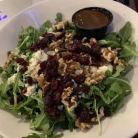 Arugula Salad · Mixed greens, cranberries, walnuts, bleu cheese, honey balsamic vinaigrette.