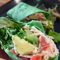 Spinach Turkey Caesar Wrap · Oven roasted turkey, spinach, tomato, avocado, Parmesan cheese, red onions, and Caesar dress...