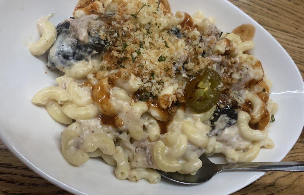 Piggy Mac · Our very Gouda macaroni and cheese mixed with our scrumptious pulled pork.