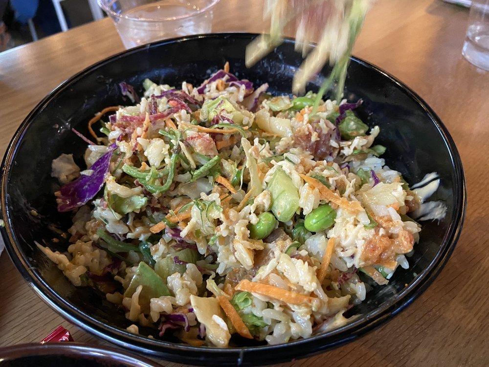 Super Poke Bowl · Fresh tuna, salmon, spicy tuna, crab salad, lettuce, beets, carrots, cabbage, cucumber, avocado, edamame, seaweed salad, eel sauce, spicy mayo, and pickled ginger.