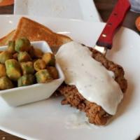 Chicken Fried Steak · An 8 oz. chicken fried steak served with gravy. Served with your choice of side, a side sala...