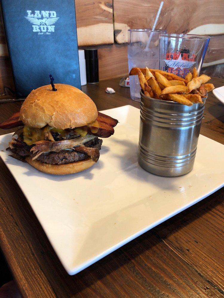 Oink and Moo Burger · Smoked pulled pork, grilled hot link cheddar cheese, smothered in BBQ sauce. Our 7 ounce burger are made with 100% Kobe derived Akaushi beef, cooked Medium Well unless specified otherwise.  Served with hand cut fries or chips. Choose your bun!