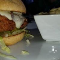 Spicy Fried Chicken Sandwich · Served with mayo, lettuce, and pickles, and pepper jack cheese on hatch green chile bun. Ser...
