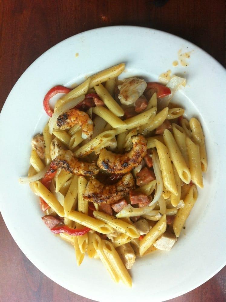 Cajun Pasta · Shrimp, chicken, smoked andouille sausage, onions, peppers, and penne pasta tossed in our homemade Cajun cream sauce.