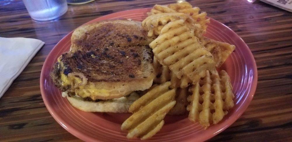 Grilled Cheese Burger · That’s right! A grilled cheese burger. Best of both worlds with American and cheddar cheese. Served on buttered sourdough bread.