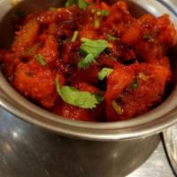Gobi Manchurian · Cauliflower Asian inspired tomato glazed and cooked until dry.