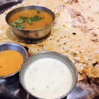 Onion Rava Masala Dosa · Rava dosa filled with onions and mildly spiced potato filling.