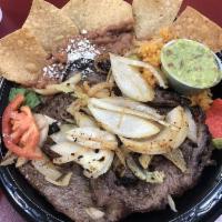 Carne Asada Plate · Steak marinated and cooked in the grill Served with Spanish Rice, Beans and tortillas 