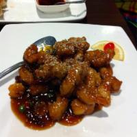 Sesame Chicken · Strips of chicken breast battered and deep fried toss with  sweet and spicy sauce. Top off w...