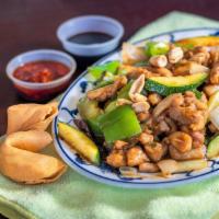 Kung Pao Chicken · Diced chicken meat with peanuts, onions, dry chili peppers and zucchini in our traditional k...
